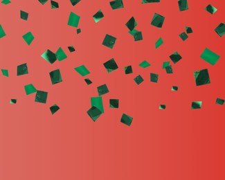 Image of Shiny green confetti falling on red background