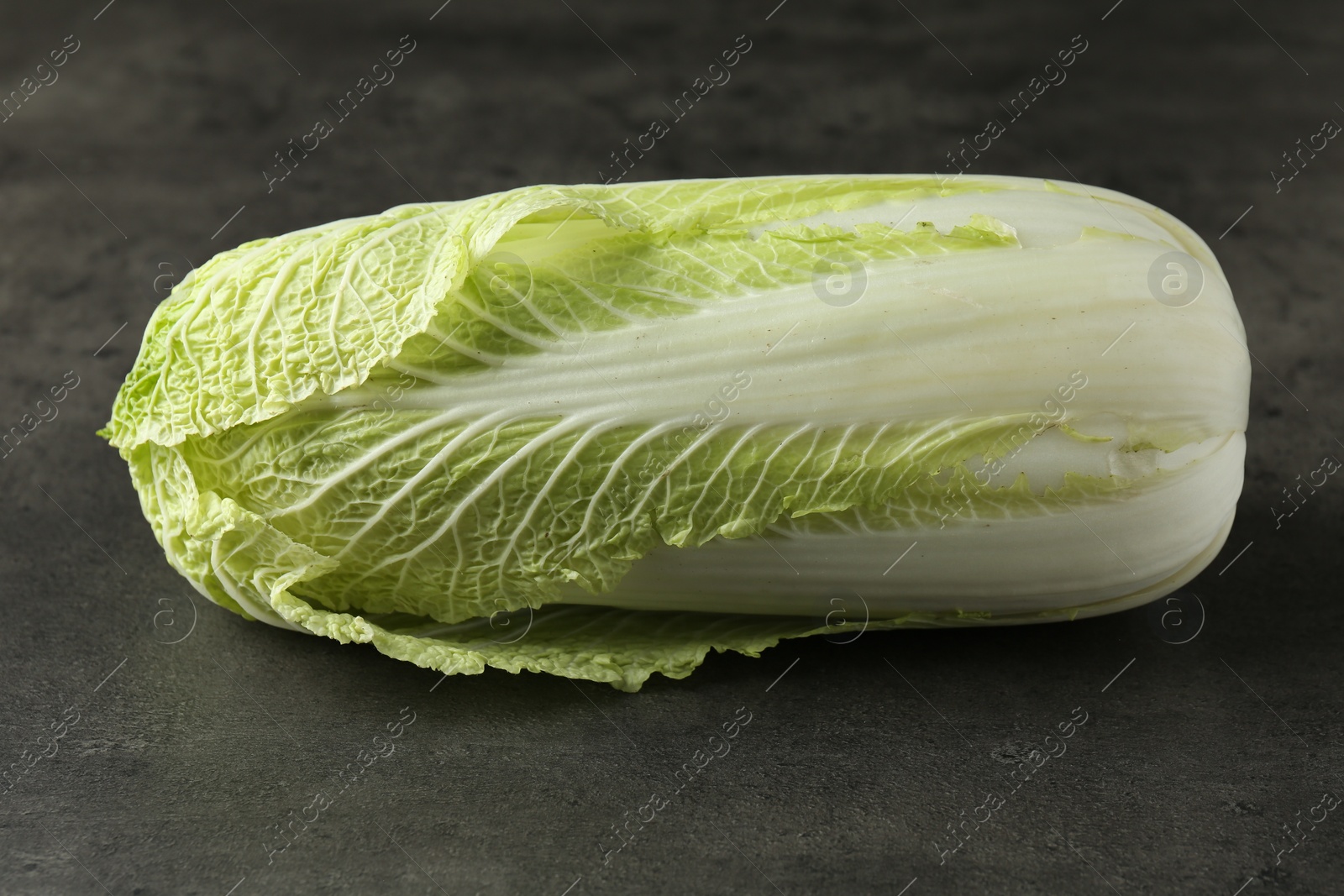 Photo of Fresh ripe Chinese cabbage on grey table