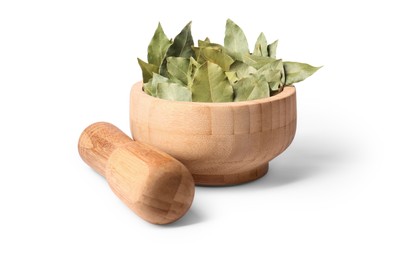 Wooden mortar with aromatic bay leaves and pestle on white background