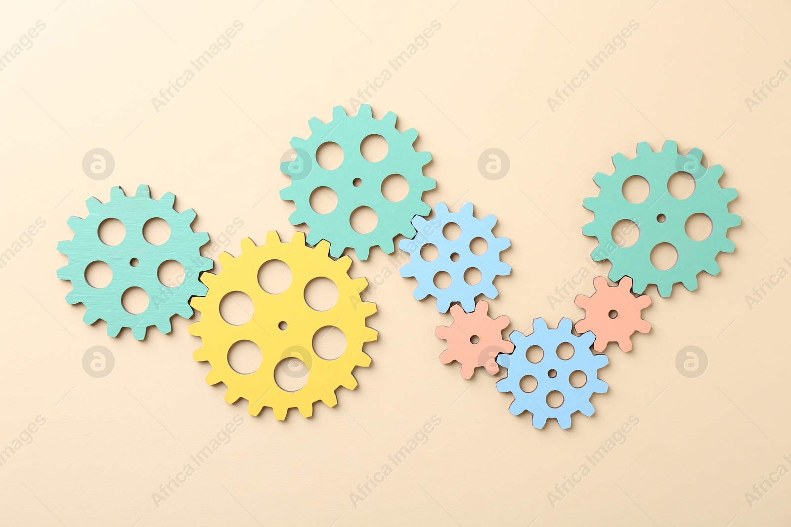 Photo of Business process organization and optimization. Scheme with colorful figures on beige background, top view