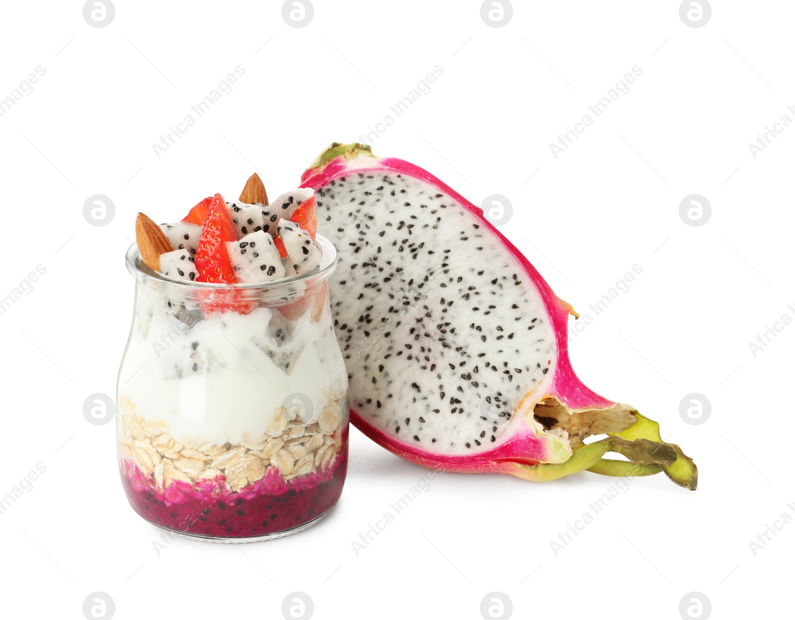 Photo of Glass jar of granola with pitahaya, yogurt and strawberries on white background