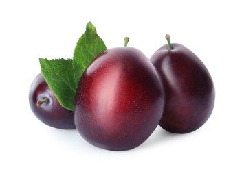 Delicious fresh ripe plums on white background