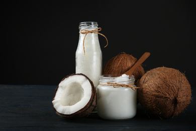 Fresh coconut oil on dark wooden table. Cooking ingredient