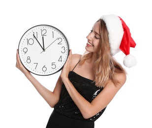 Photo of Happy young woman in Santa hat holding clock on white background. Christmas celebration