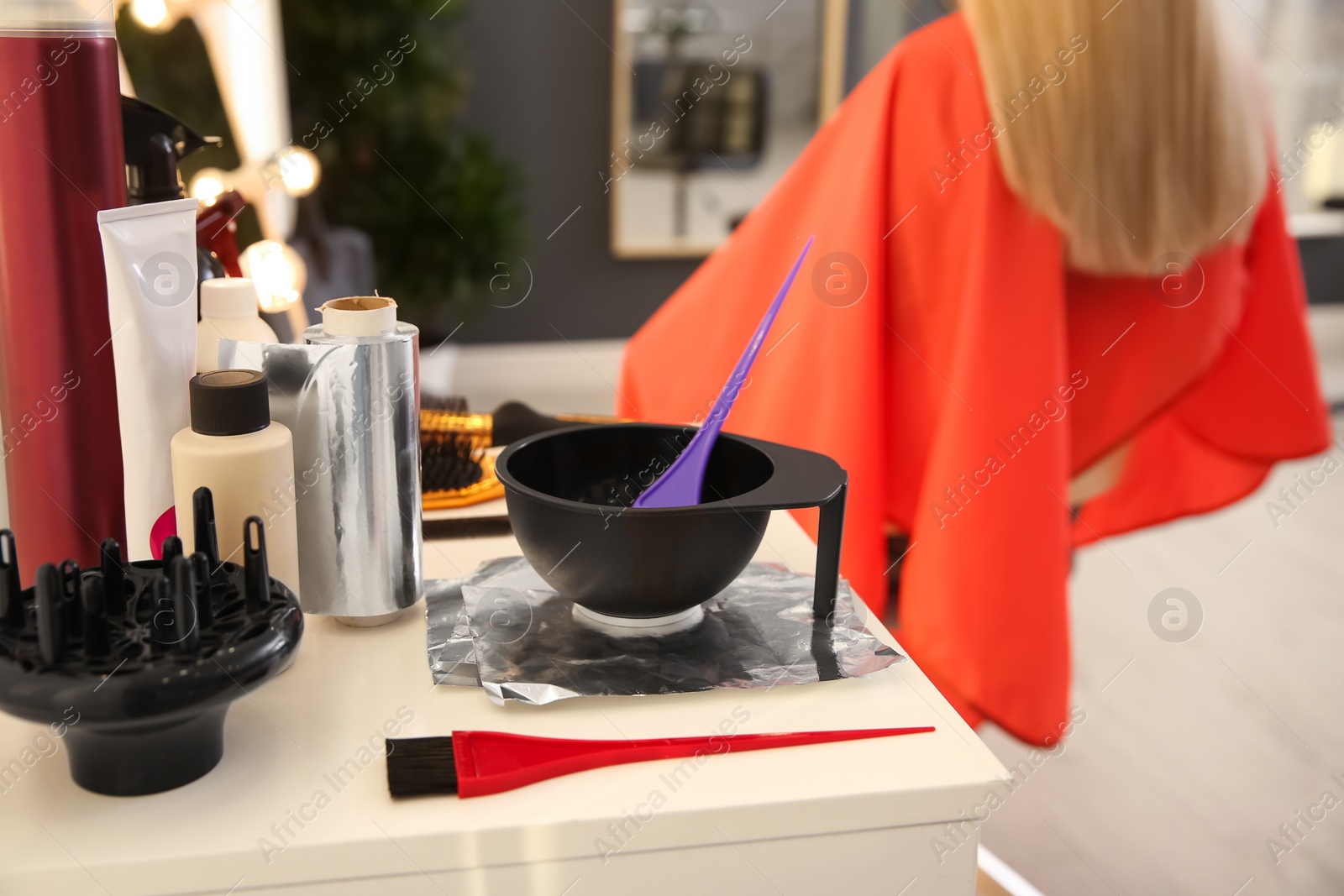 Photo of Workplace with hair dye kit in beauty salon