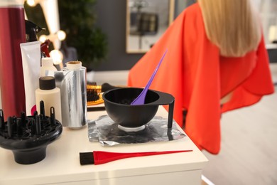 Workplace with hair dye kit in beauty salon