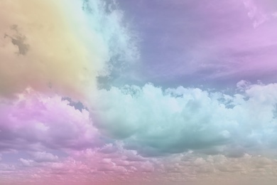 Fantasy world. Picturesque view of beautiful magic sky with fluffy clouds, toned in pastel rainbow or unicorn colors