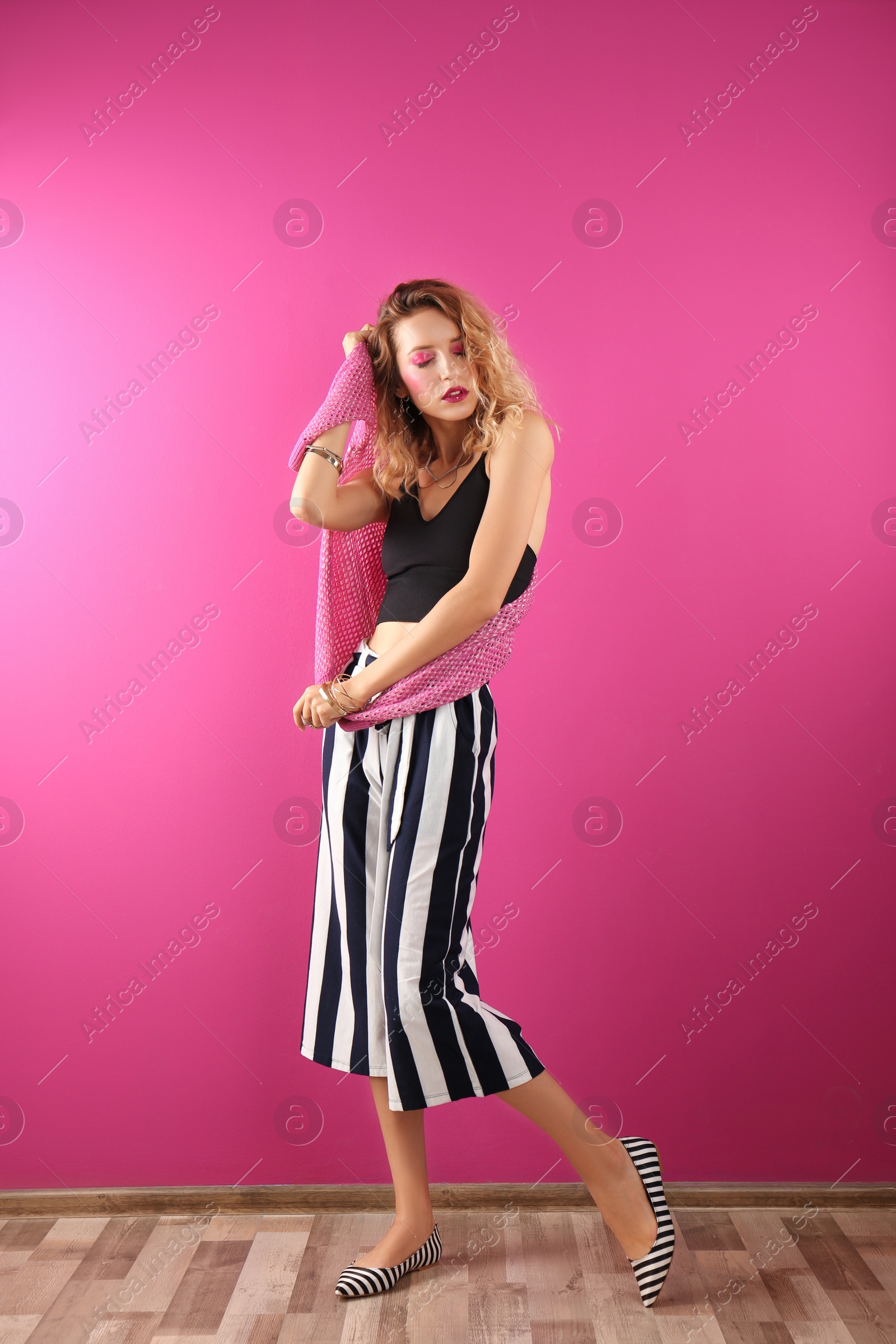 Photo of Beautiful young woman posing on color background. Summer fashion