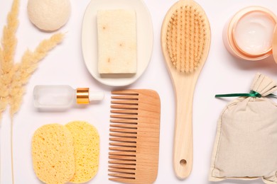 Photo of Bath accessories. Different personal care products and dry spikelets on white background, flat lay