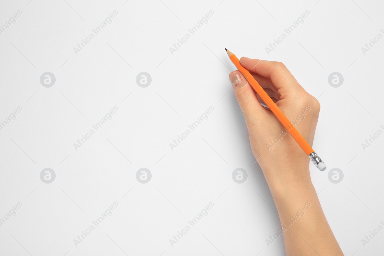 Photo of Woman with new graphite pencil on white background, top view. Space for text