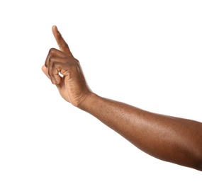 African-American man pointing at something on white background, closeup