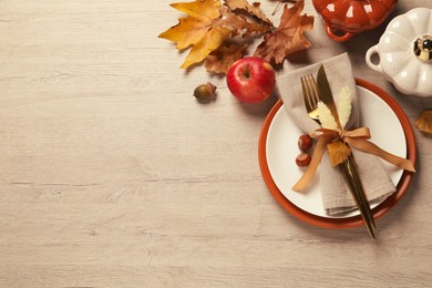 Autumn table setting on wooden background, flat lay. Space for text
