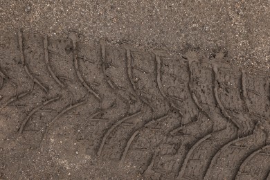 Photo of Texture of wet ground surface as background, top view