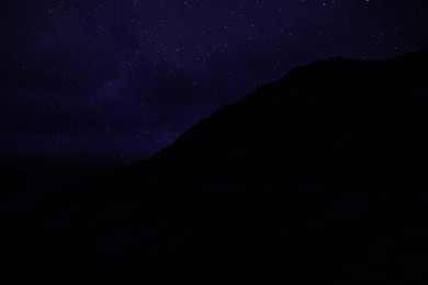 Beautiful view of starry sky over mountains at night