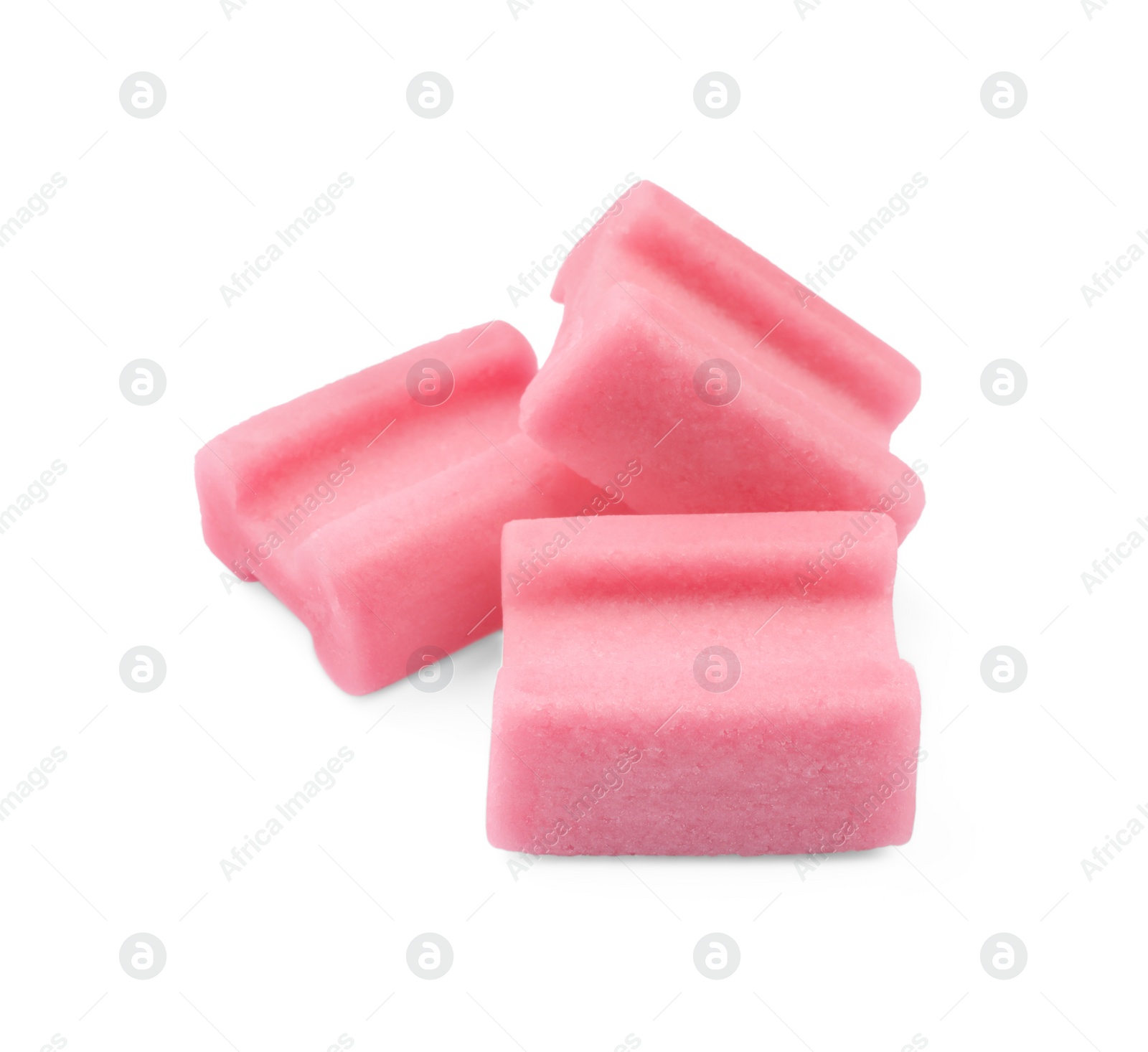 Photo of Tasty pink chewing gums on white background