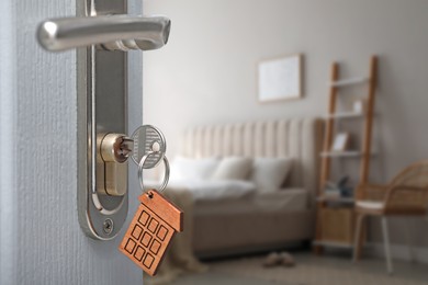 Image of Closeup view of door with key open in bedroom 