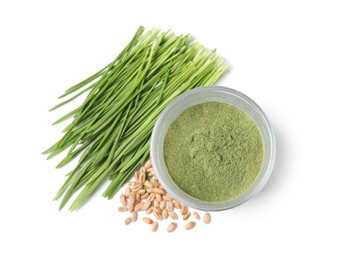 Photo of Wheat grass powder in glass, seeds and fresh sprouts isolated on white, top view