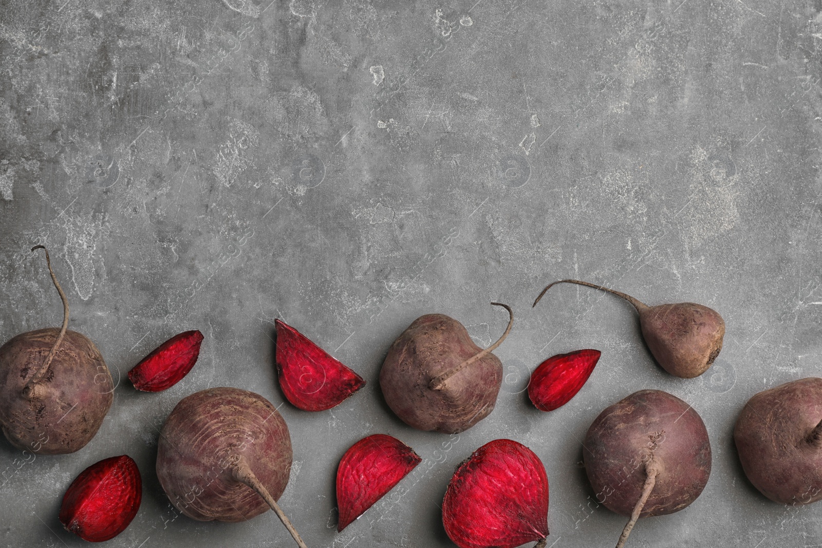 Photo of Flat lay composition with ripe beets on grey background