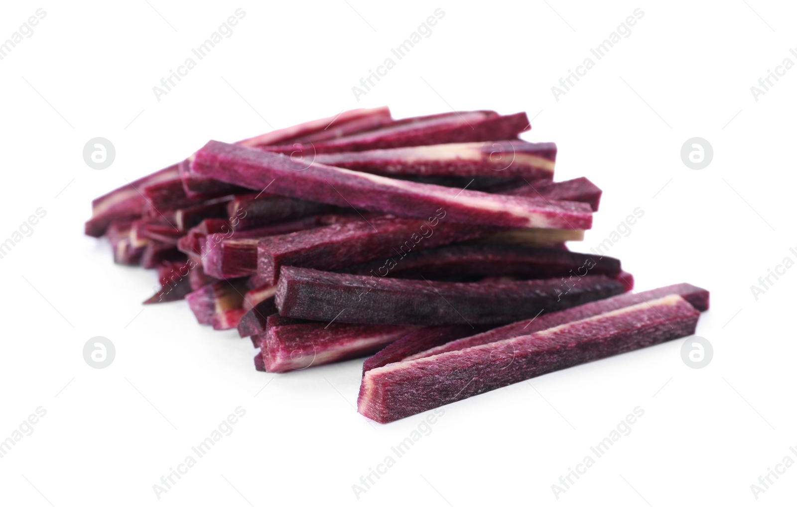 Photo of Raw purple carrot sticks isolated on white