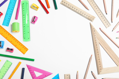 Photo of Different plastic and wooden stationery on white background, top view. Recycling concept