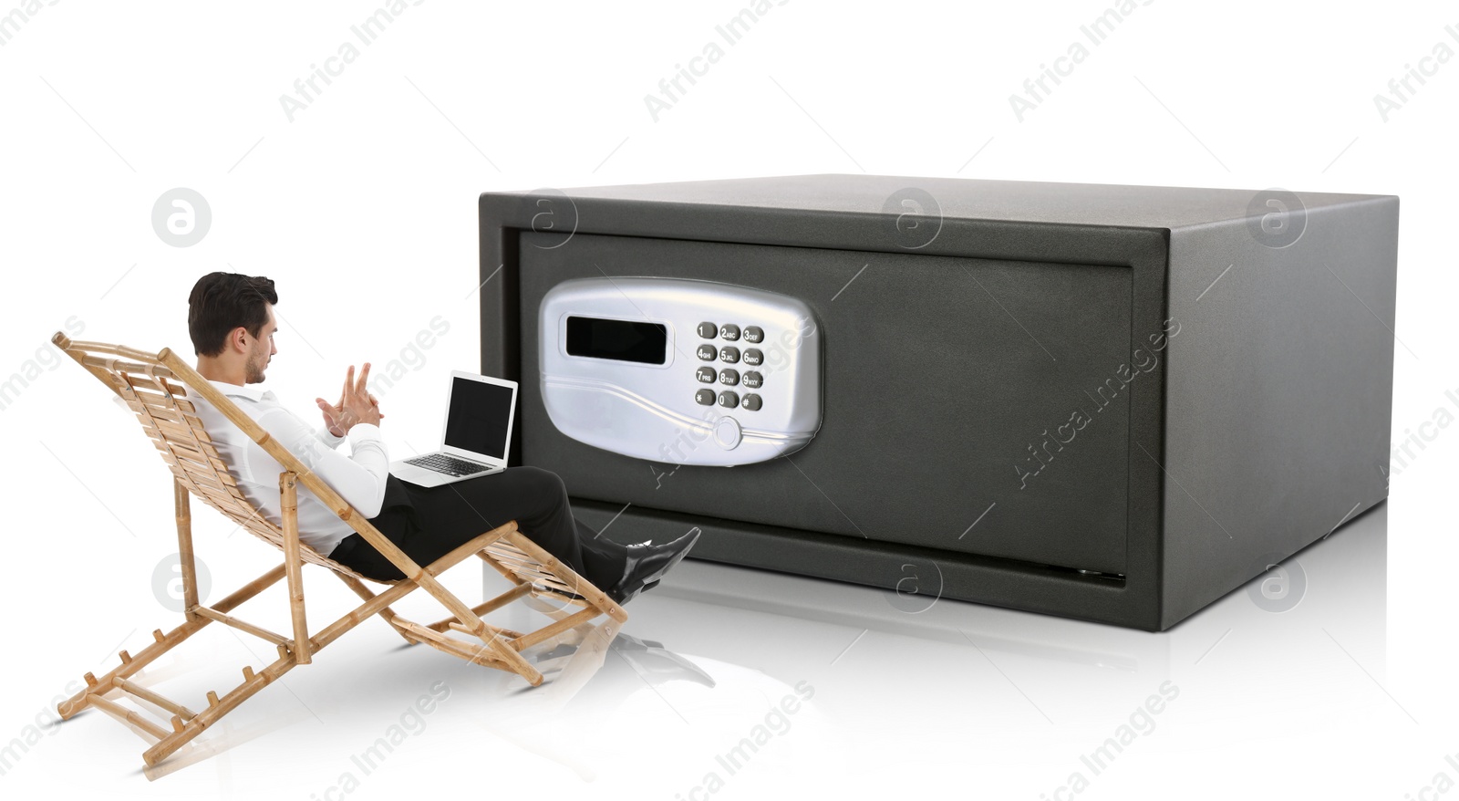 Image of Financial security, keeping money. Thoughtful businessman with laptop in front of big steel safe, white background