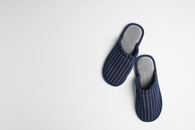 Photo of Pair of stylish slippers on light grey background, top view. Space for text