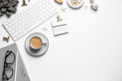 Photo of Composition with keyboard and coffee on white background, top view