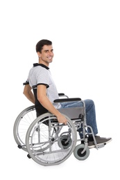 Photo of Handsome young man in wheelchair isolated on white