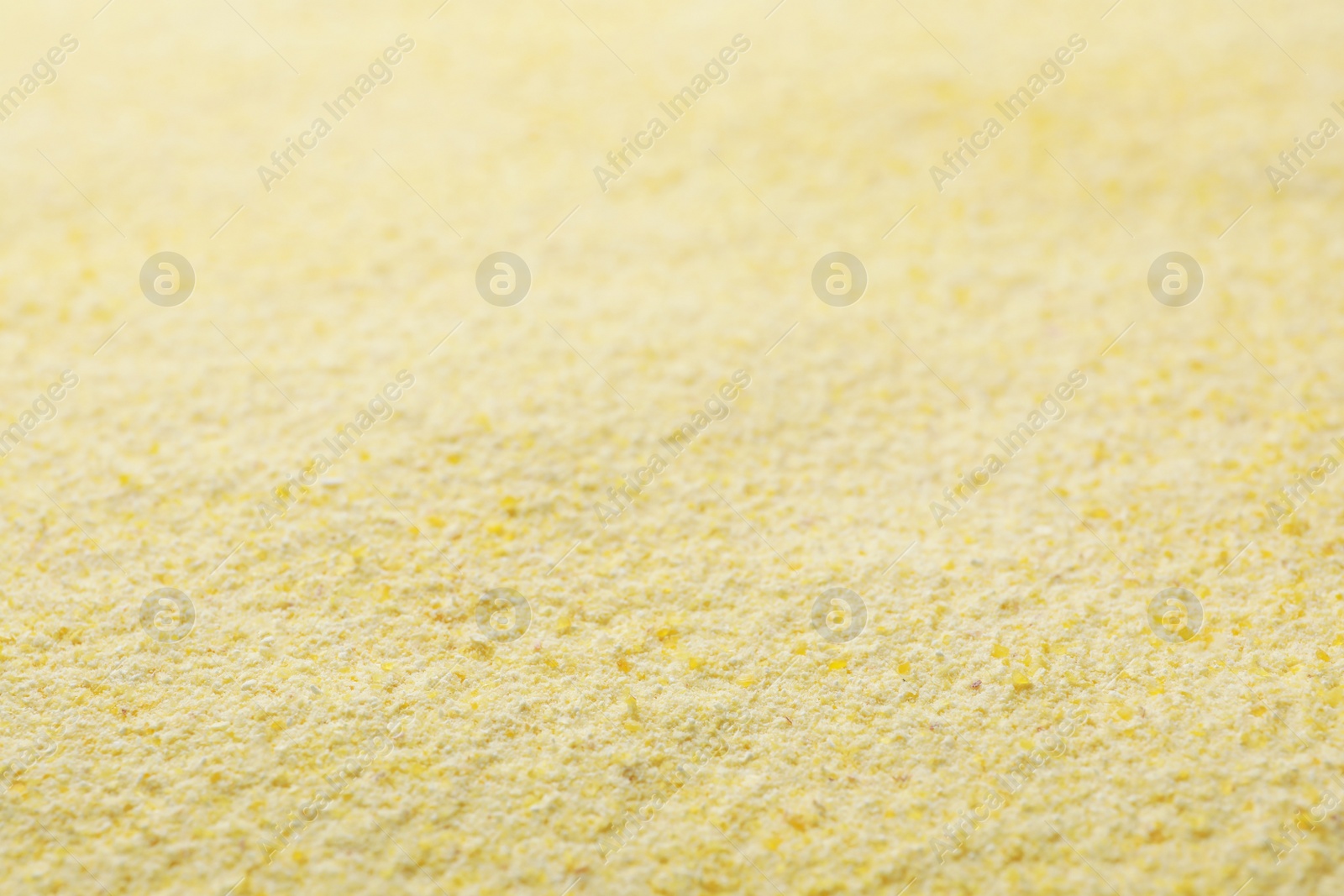 Photo of Corn flour as background, closeup. Gluten free product
