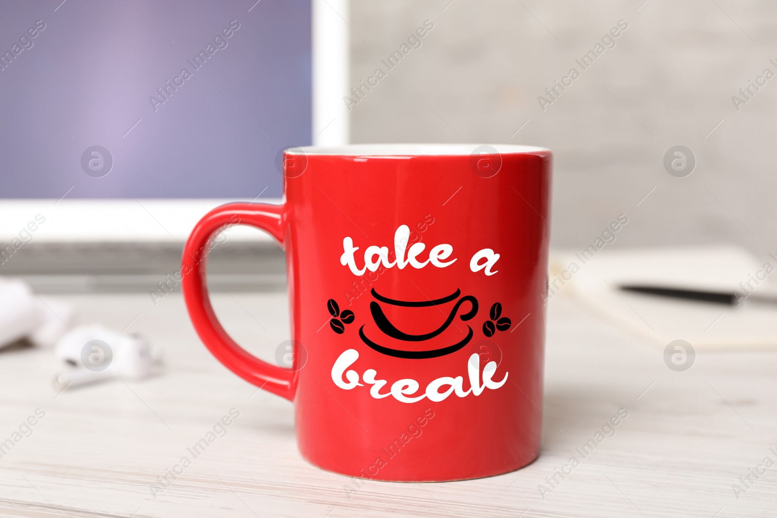 Image of Cup of coffee with inscription Take a Break on white wooden table in office