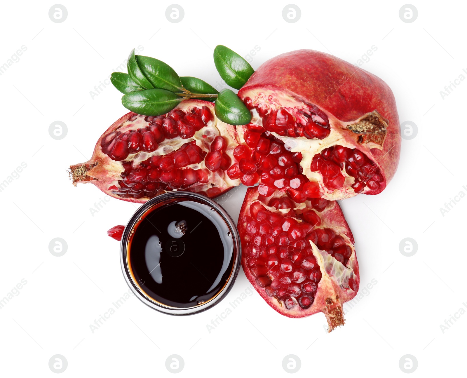 Photo of Tasty pomegranate sauce in bowl, branch and fruits isolated on white, top view