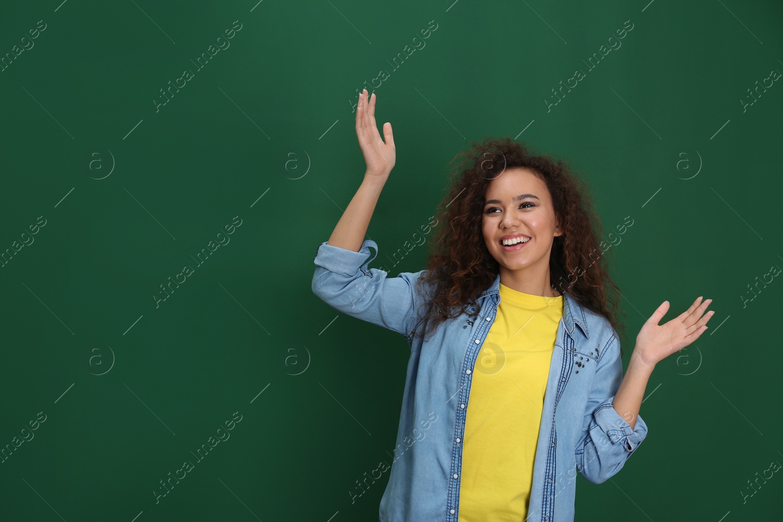 Photo of Portrait of emotional African-American woman on color background. Space for text