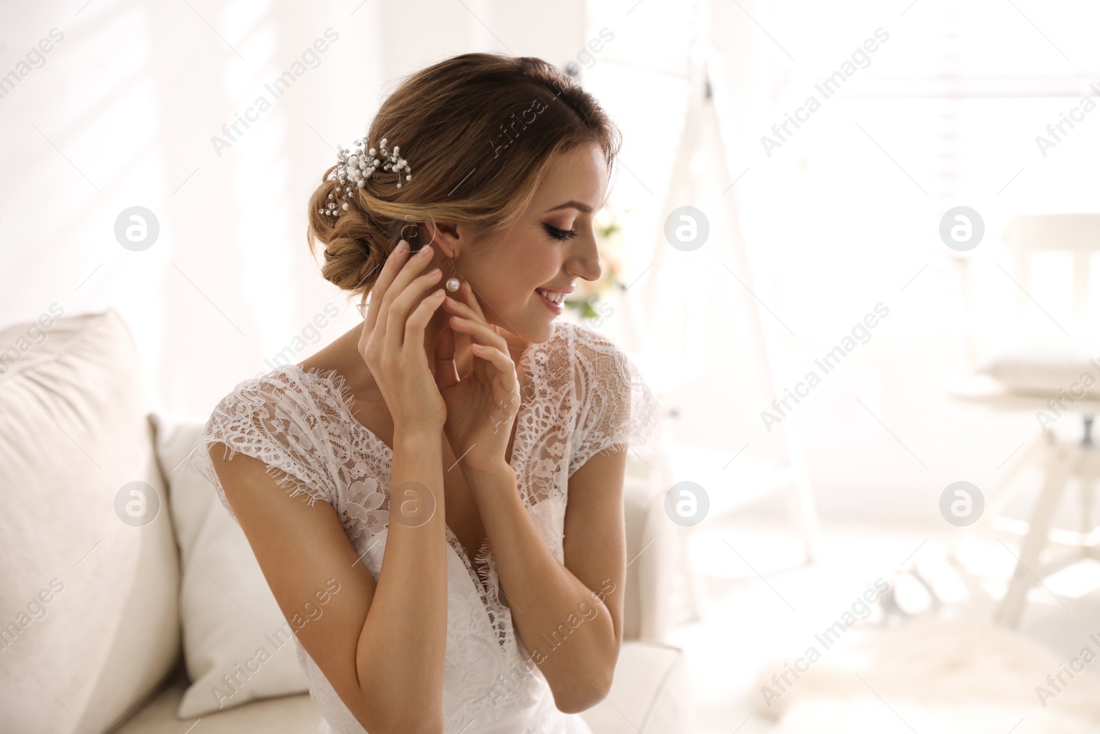 Photo of Gorgeous bride in beautiful wedding dress indoors. Space for text