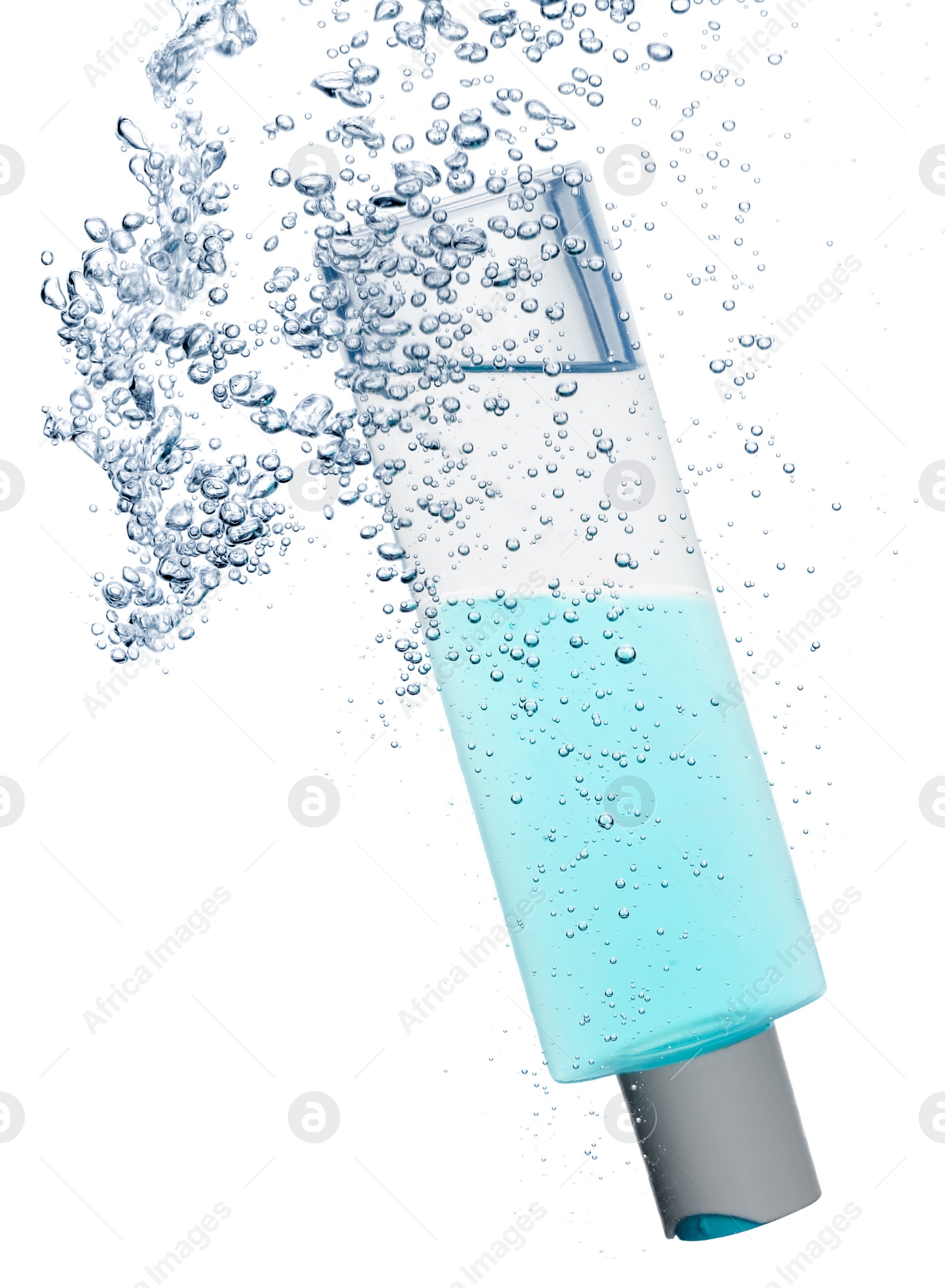 Photo of Bottle of micellar water with bubbles on white background