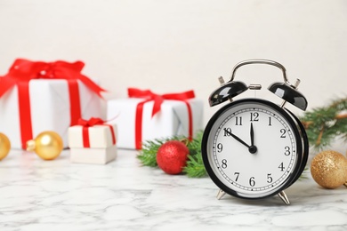 Photo of Retro alarm clock and decor on table. Christmas countdown