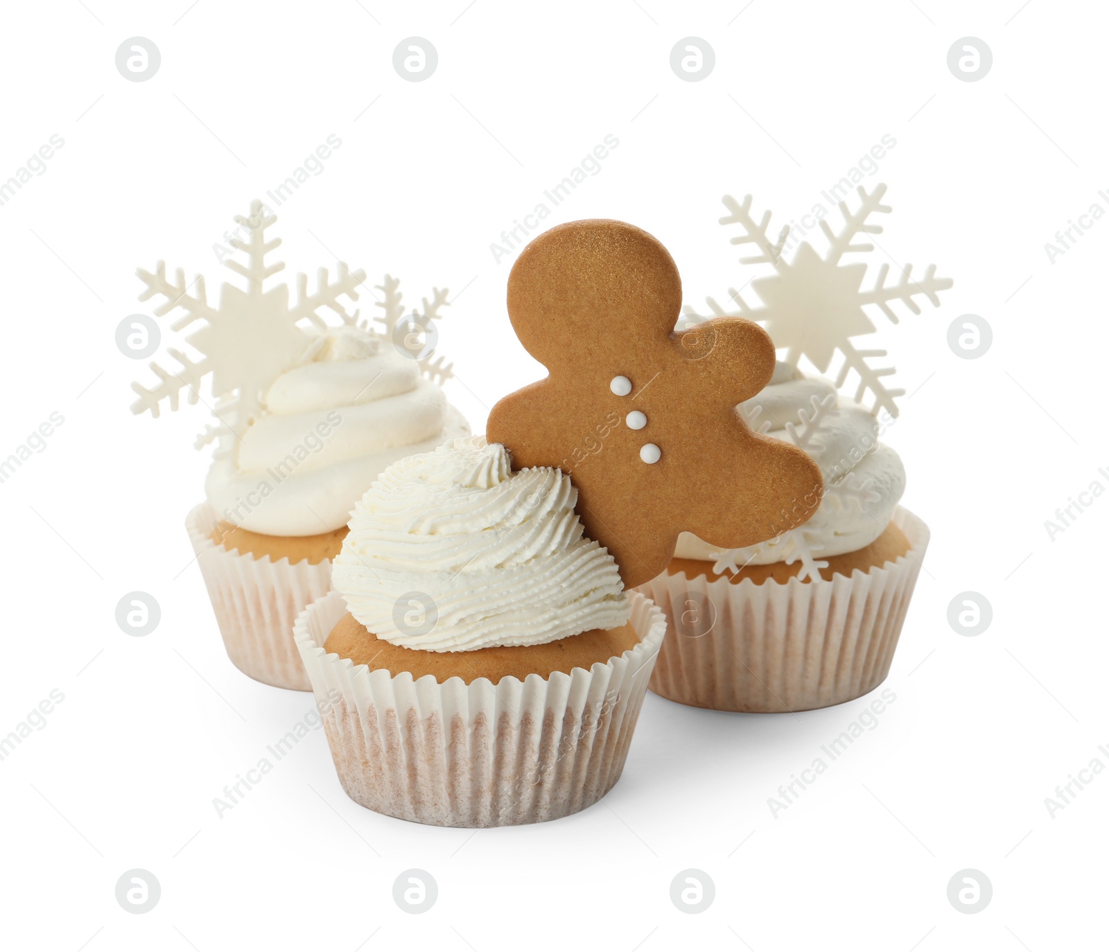 Photo of Tasty Christmas cupcakes with snowflakes and gingerbread man on white background
