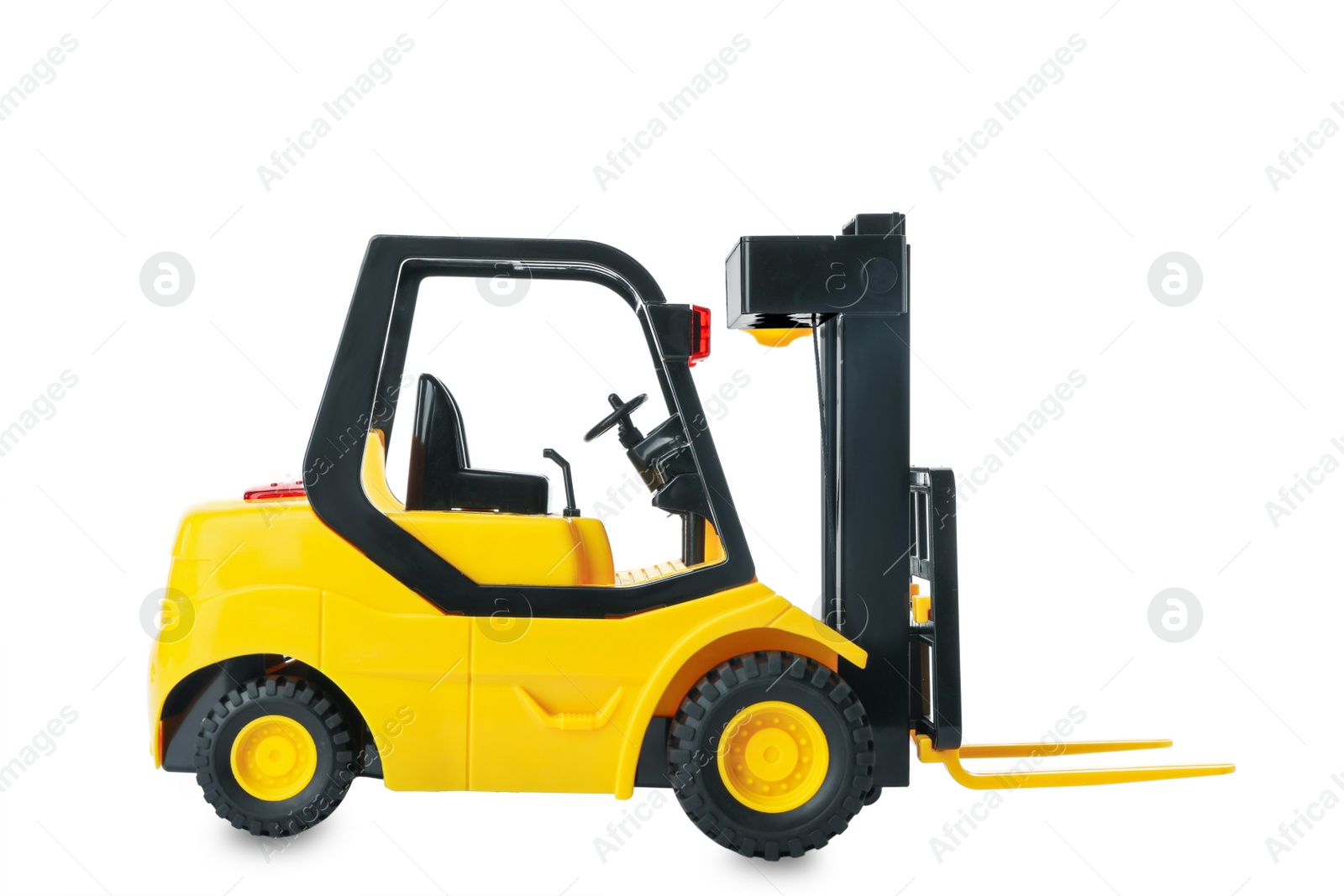 Photo of Toy forklift isolated on white. Logistics and wholesale concept