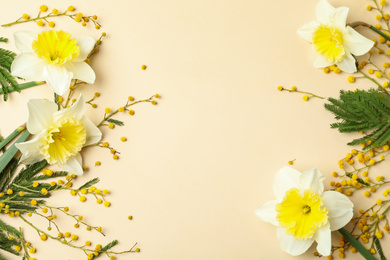 Photo of Flat lay composition with spring flowers on beige background, space for text