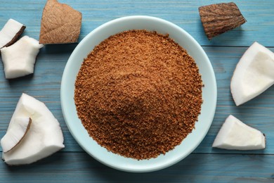 Flat lay composition with natural coconut sugar on blue wooden table