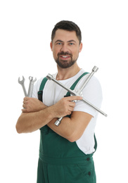 Photo of Portrait of professional auto mechanic with wrenches on white background