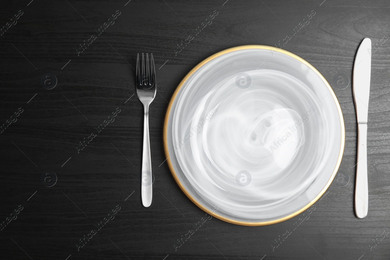 Photo of Elegant table setting on dark background, top view