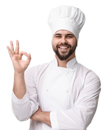 Photo of Happy young chef in uniform showing ok gesture on white background