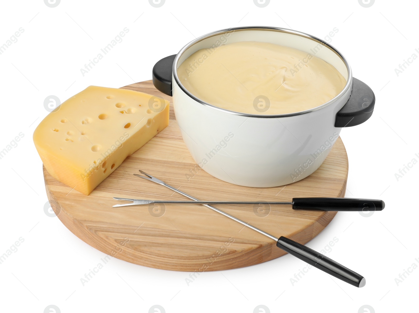 Photo of Fondue with tasty melted cheese, forks and piece isolated on white