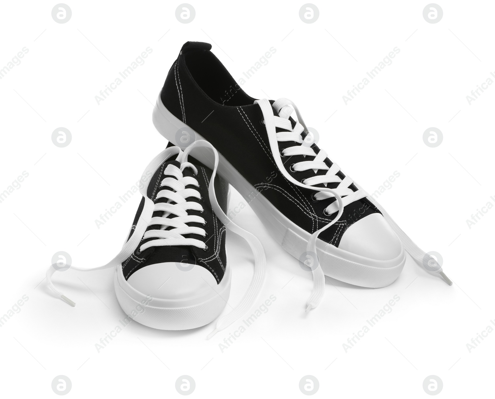 Photo of Pair of black classic old school sneakers isolated on white