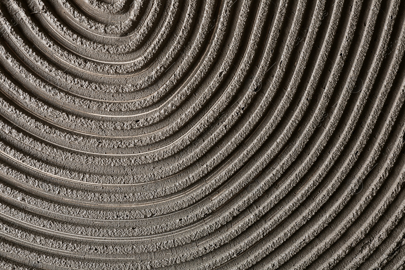 Photo of Lined grey concrete as background, top view. Tile installation