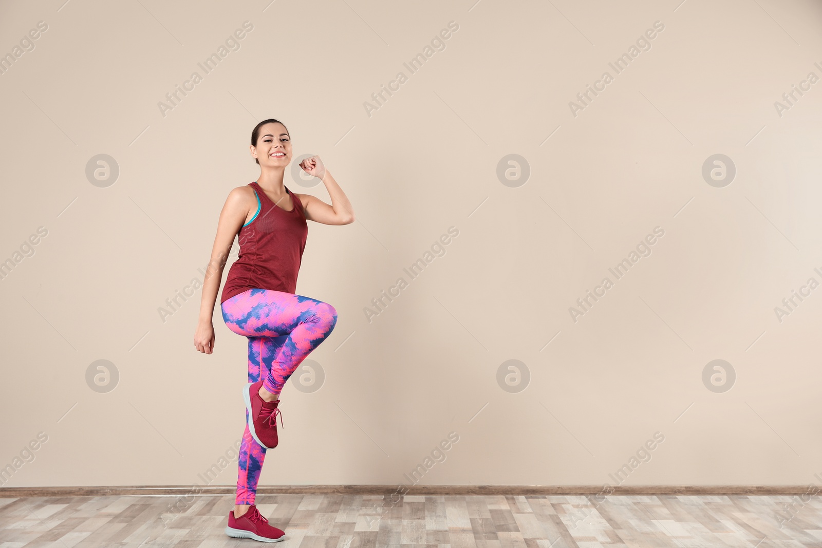 Photo of Young beautiful woman doing exercise at home, space for text. Workout and fitness