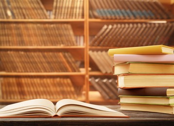 Image of Different books on wooden table in library