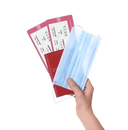 Photo of Woman holding passport, tickets and protective mask on white background, closeup. Travel during quarantine