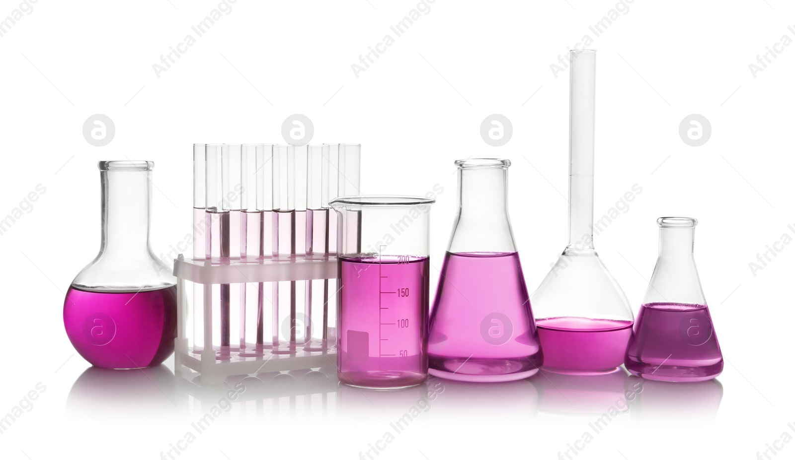 Photo of Laboratory glassware with purple liquid on white background