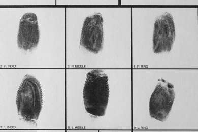 Police form with fingerprints, top view. Forensic examination